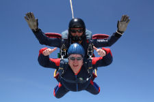 Damian grinning as he falls from 13,000 feet